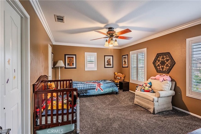 bedroom with carpet flooring, ornamental molding, baseboards, and ceiling fan