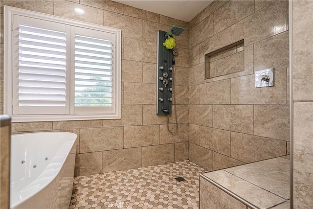 full bath with tiled shower and a whirlpool tub