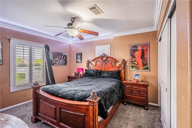 carpeted bedroom featuring crown molding, baseboards, and a ceiling fan