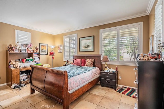 bedroom with light tile patterned floors, ornamental molding, multiple windows, and baseboards
