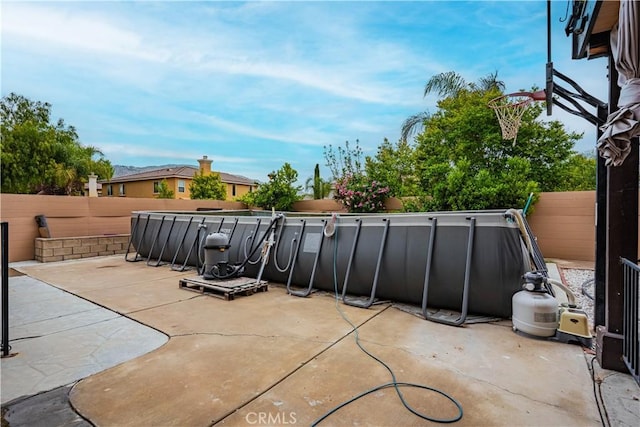 view of patio / terrace featuring fence