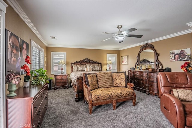 carpeted bedroom featuring crown molding and a ceiling fan