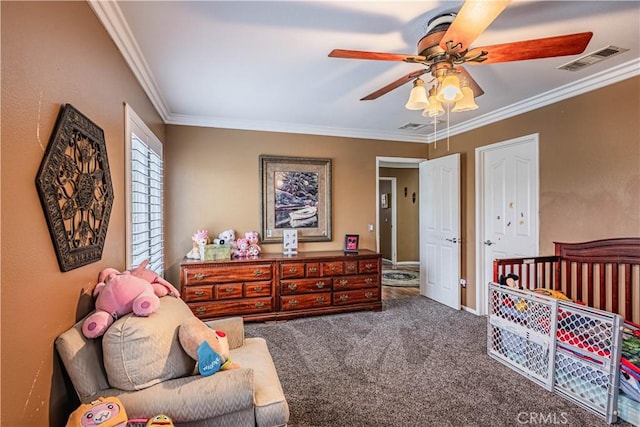 bedroom featuring carpet flooring, ornamental molding, ceiling fan, and baseboards