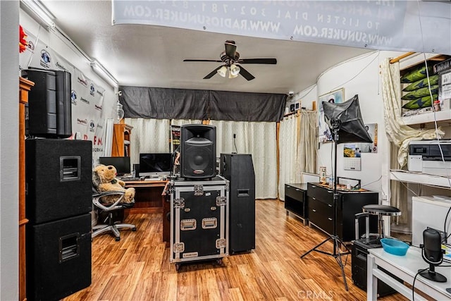 home office with wood finished floors and ceiling fan
