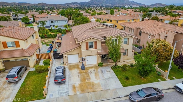 aerial view of residential area featuring a mountain backdrop