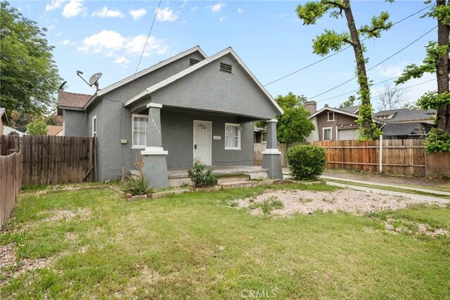 view of front of home with stucco siding and covered porch