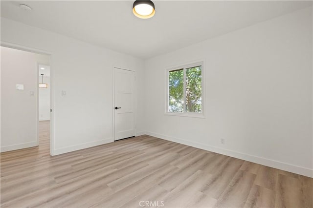 5826 Jamieson Ave, Encino, CA 91316 - empty room featuring light wood-style floors, baseboards, and a smoke detector