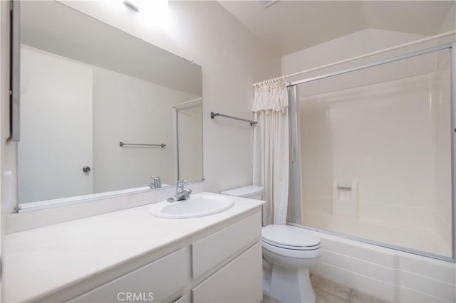 bathroom featuring shower / bathtub combination with curtain, toilet, vanity, and tile patterned flooring