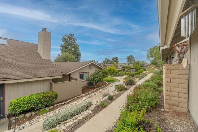 view of yard featuring fence and central AC unit