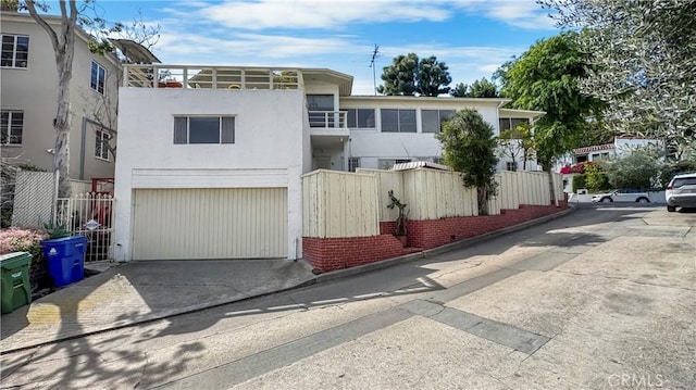 2001 Kenilworth Ave, Los Angeles, CA 90039 - view of front of house featuring a garage, driveway, and fence