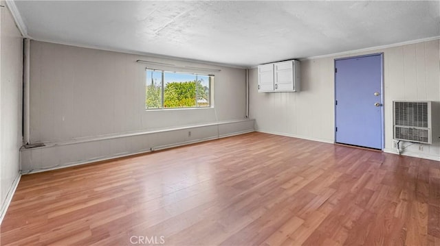 2001 Kenilworth Ave, Los Angeles, CA 90039 - spare room with heating unit, light wood-style floors, ornamental molding, and baseboards