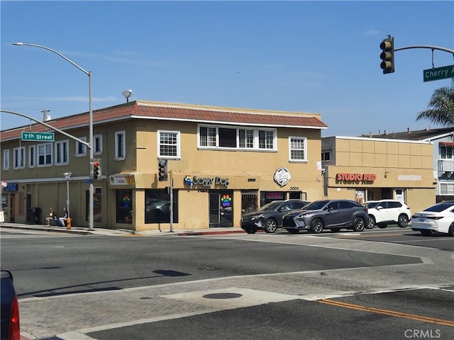 view of commercial property featuring uncovered parking
