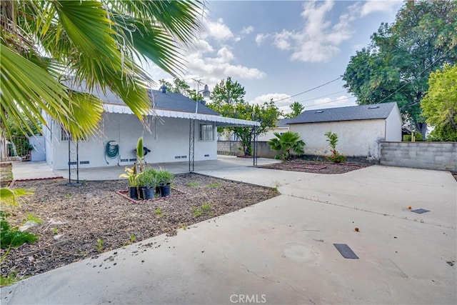 6255 Satsuma Ave, North Hollywood, CA 91606 - view of yard featuring a patio, a carport, and driveway