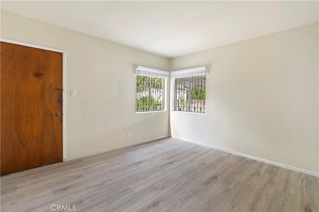 6255 Satsuma Ave, North Hollywood, CA 91606 - spare room featuring light wood finished floors and baseboards