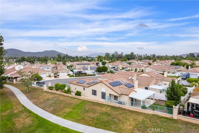 aerial view of residential area featuring a mountainous background
