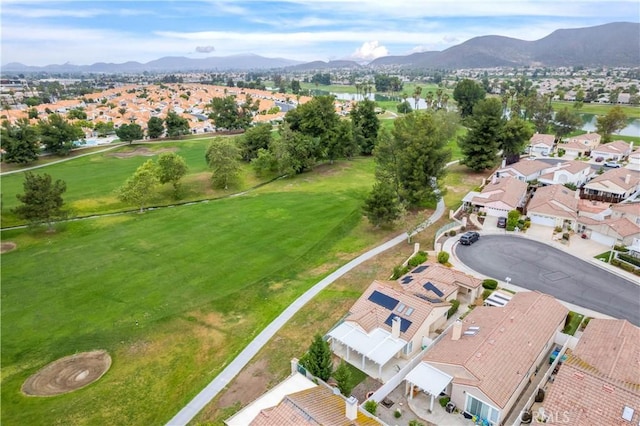 aerial perspective of suburban area featuring a water and mountain view and a golf course