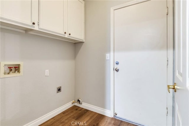 washroom featuring hookup for an electric dryer, hookup for a washing machine, cabinet space, dark wood-style floors, and baseboards