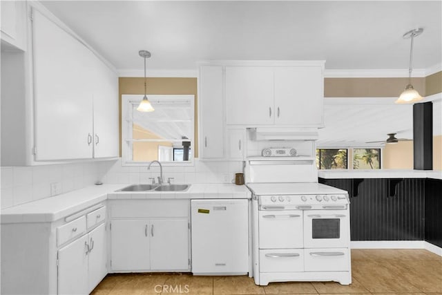 4662 Howard Ave, Los Alamitos, CA 90720 - kitchen featuring white appliances, a sink, tile counters, white cabinets, and ornamental molding