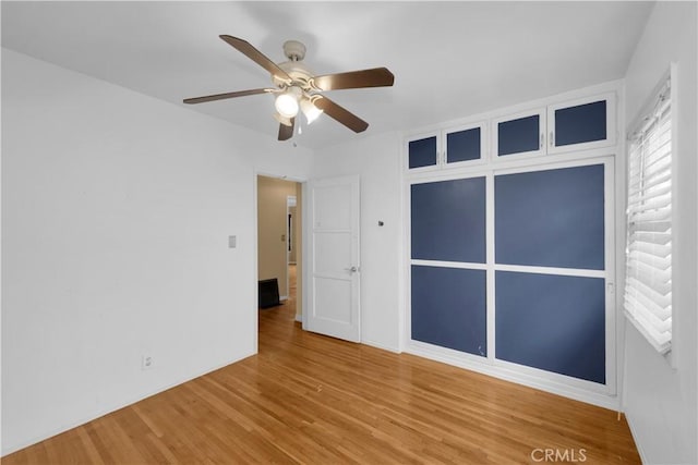 4662 Howard Ave, Los Alamitos, CA 90720 - unfurnished bedroom with wood finished floors and ceiling fan