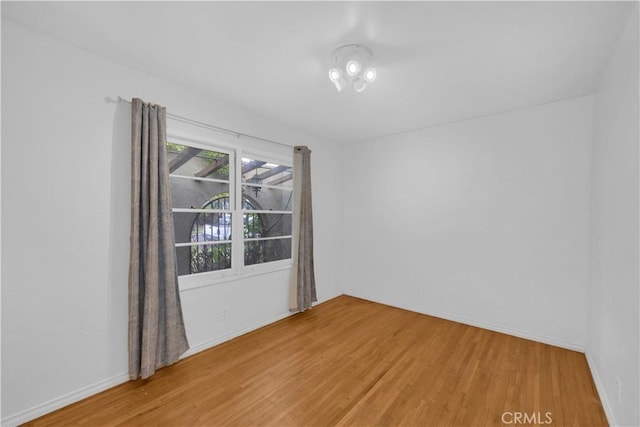 4662 Howard Ave, Los Alamitos, CA 90720 - unfurnished room featuring wood finished floors and baseboards
