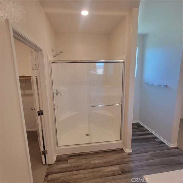 29145 Dune Primrose, Lake Elsinore, CA 92530 - full bath featuring wood finished floors, a shower stall, a spacious closet, and recessed lighting