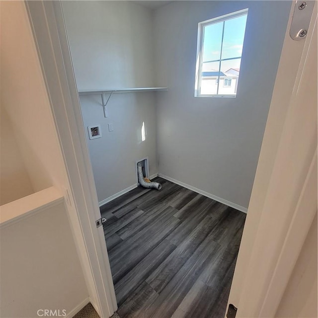 clothes washing area with hookup for a washing machine, dark wood-style flooring, and baseboards