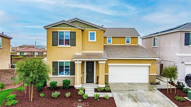 traditional home featuring driveway and stucco siding