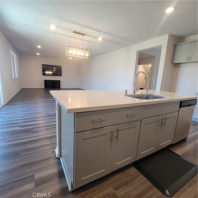 29145 Dune Primrose, Lake Elsinore, CA 92530 - kitchen with dishwasher, open floor plan, light countertops, dark wood finished floors, and a center island with sink