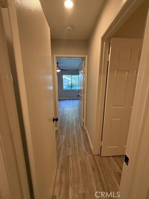 20234 Cantara St Unit 143, Winnetka, CA 91306 - hallway with wood finished floors and baseboards