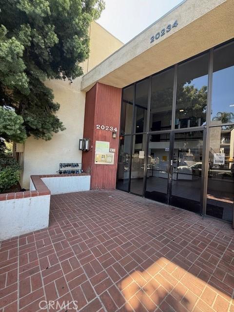20234 Cantara St Unit 143, Winnetka, CA 91306 - doorway to property with stucco siding