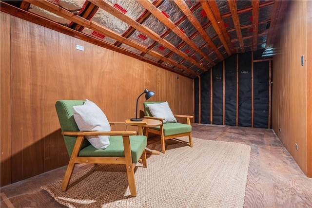 living area featuring wooden walls