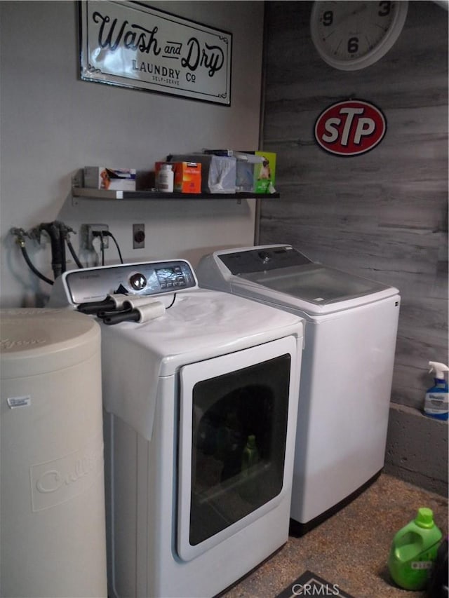 clothes washing area featuring washing machine and dryer