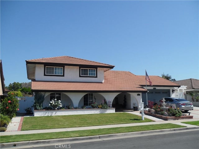 view of front of home featuring a garage, stucco siding, and a tile roof