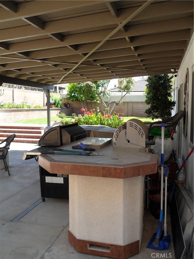 view of patio / terrace featuring fence and area for grilling