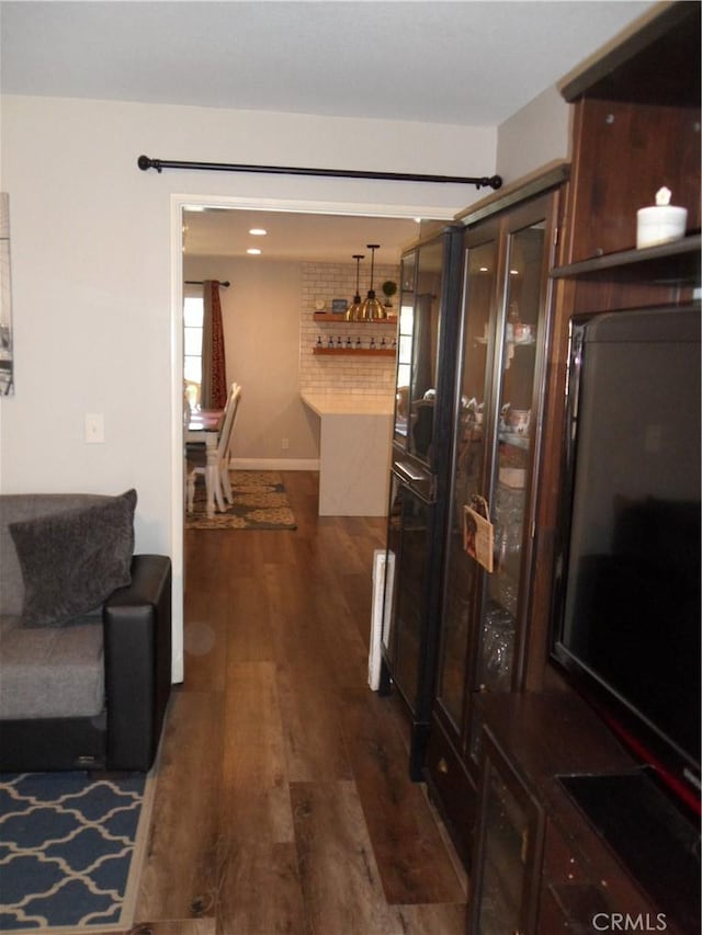 hallway with dark wood finished floors