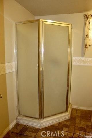 36072 Meadow Grove Rd, Yermo, CA 92398 - full bathroom with a shower stall and brick patterned floors