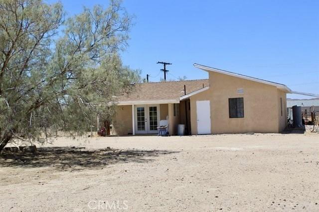 36072 Meadow Grove Rd, Yermo, CA 92398 - rear view of house with french doors and stucco siding