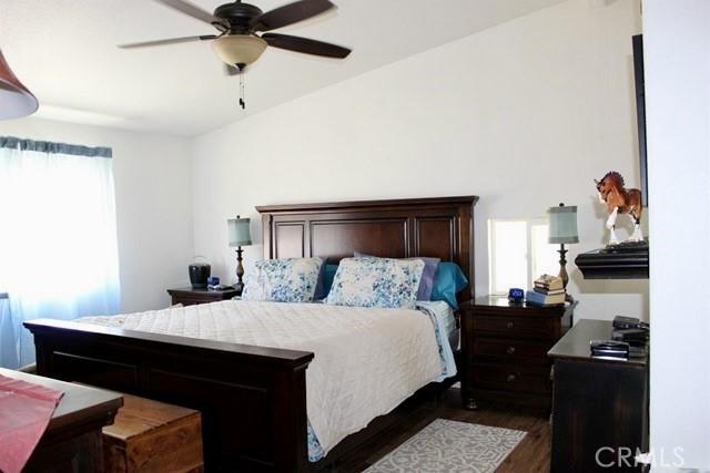 36072 Meadow Grove Rd, Yermo, CA 92398 - bedroom with dark wood finished floors and a ceiling fan