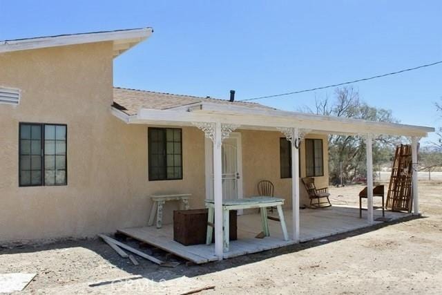 36072 Meadow Grove Rd, Yermo, CA 92398 - rear view of house with stucco siding and a patio area