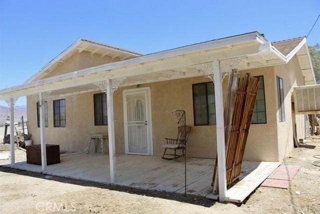36072 Meadow Grove Rd, Yermo, CA 92398 - back of house with stucco siding and a patio area