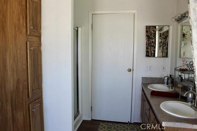 36072 Meadow Grove Rd, Yermo, CA 92398 - bathroom with a shower stall and double vanity