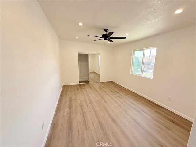 11921 4th Ave, Hesperia, CA 92345 - spare room with recessed lighting, baseboards, light wood-type flooring, and a ceiling fan