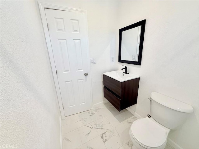 11921 4th Ave, Hesperia, CA 92345 - half bath featuring baseboards, marble look tile flooring, vanity, and toilet