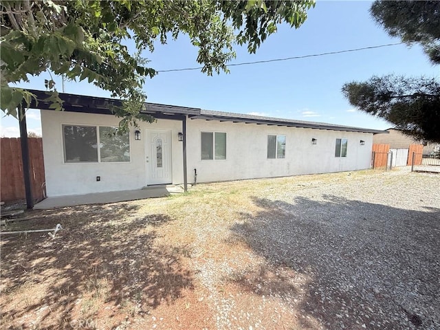 11921 4th Ave, Hesperia, CA 92345 - view of front of home featuring fence and stucco siding