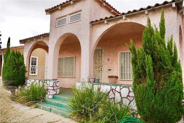 837 W 103rd St, Los Angeles, CA 90044 - view of front of property featuring a tiled roof and stucco siding