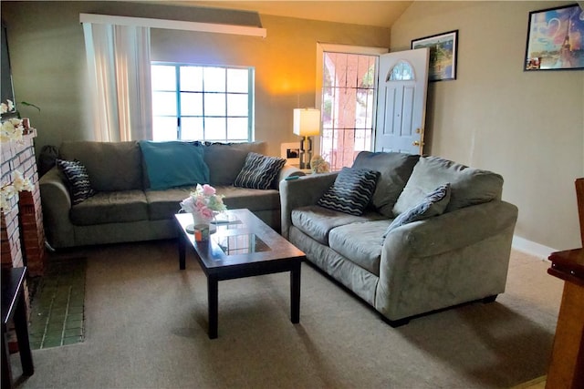 837 W 103rd St, Los Angeles, CA 90044 - carpeted living room with vaulted ceiling and a brick fireplace
