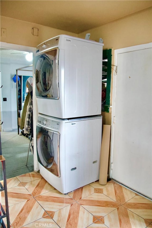 837 W 103rd St, Los Angeles, CA 90044 - washroom with stacked washer and clothes dryer