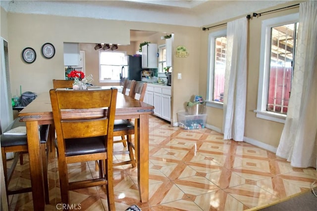 837 W 103rd St, Los Angeles, CA 90044 - dining space featuring baseboards and light tile patterned flooring