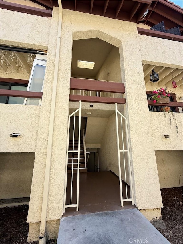 18122 Sundowner Way Unit 1108, Canyon Country, CA 91387 - doorway to property featuring stucco siding