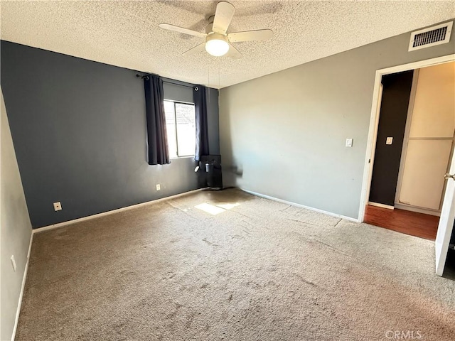 18122 Sundowner Way Unit 1108, Canyon Country, CA 91387 - carpeted spare room with ceiling fan, a textured ceiling, and baseboards